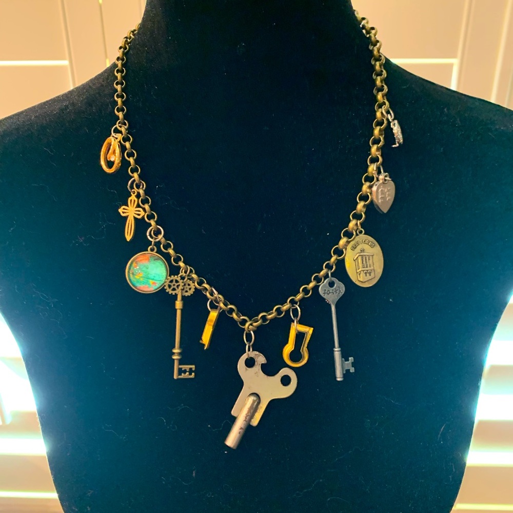 One of a kind handcrafted charm necklace. Costume jewelry with vintage details.